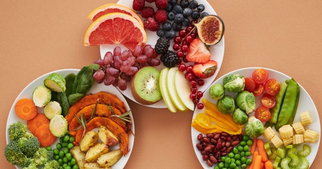 Plate with colorful vegetables and yogurt.